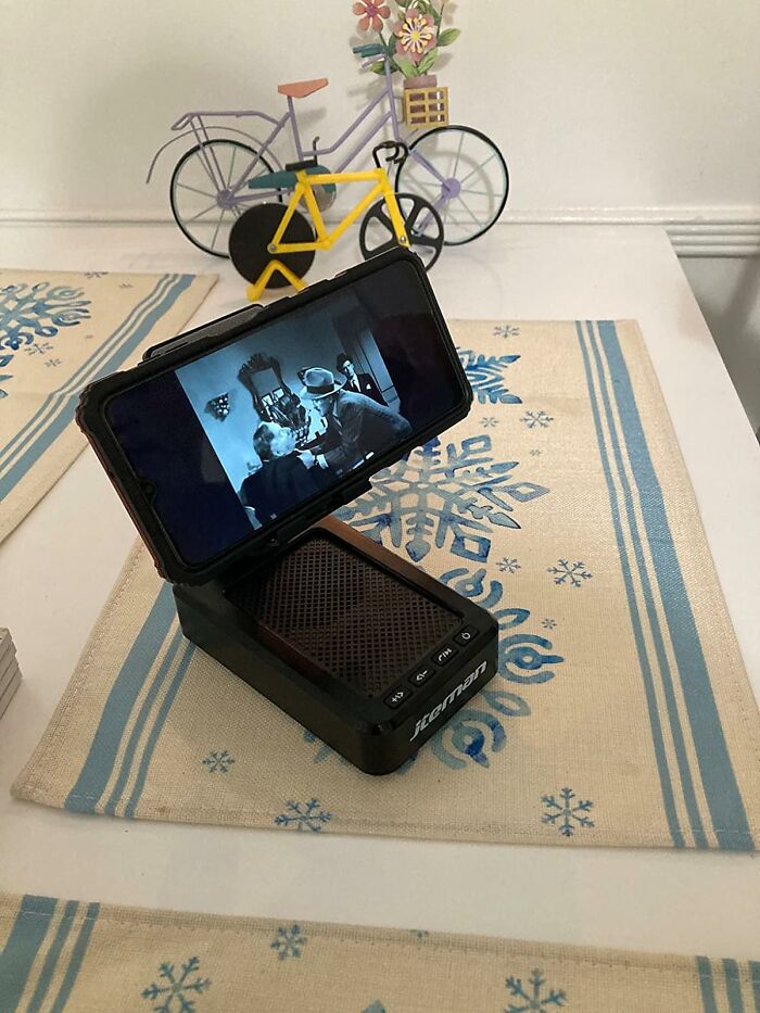 This Cell Phone Holder With Wireless Bluetooth Speaker Will Help You Stand Out