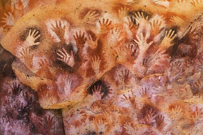 'the Cave Of Hands' In Argentina. These Prehistoric Rock Paintings Of Human Hands Were Created Around 9,000 To 13,000 Years Ago More: Https://Thetravelbible.com/Top-Artifacts-From-The-Stone-Age/