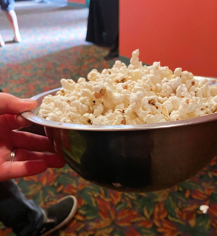 A Small Local Movie Theater Uses Reusable Metal Bowls For Popcorn