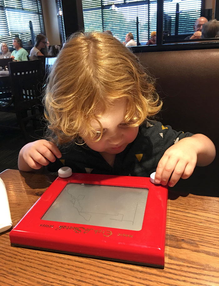 The Restaurant I’m Eating At Has Etch-A-Sketches For Children Instead Of Wasteful Paper Menus Or Coloring Pages And Crayons