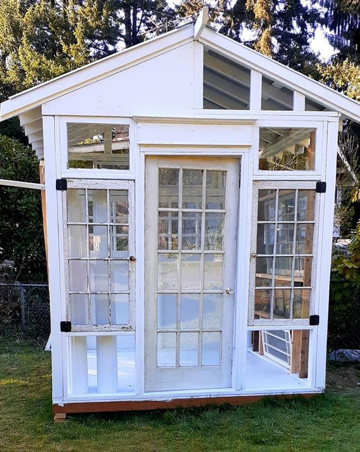 Neighbor Built This Neat Greenhouse Out Of Salvaged Windows And Doors