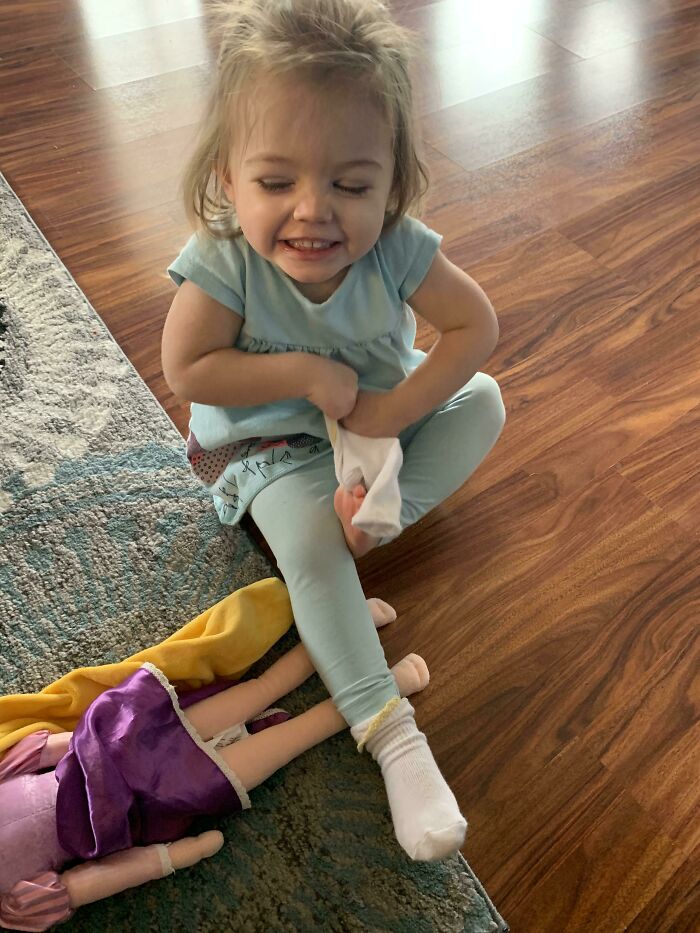 Pro Dad Tip: If You Need Your Two Year-Old Occupied For A Bit, Just Make Her Try To Put On Her Own Socks. Hours Of Diversion