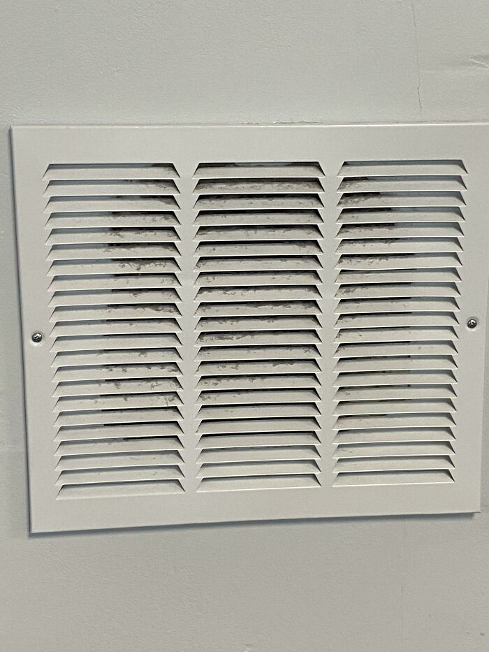 Somebody At The Gym Threw A Medicine Ball Into The Drywall. They Fixed It By Putting A Vent Grate Over It
