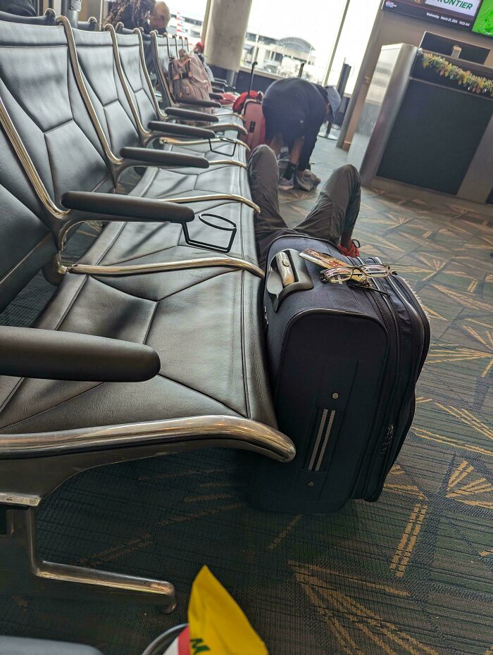Taking Up 4 Seats In A Very Crowded Airport