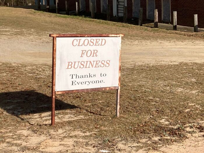 This Lone Sign At A Shut Down Store