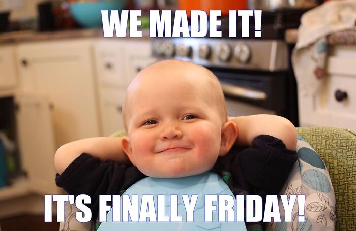 A baby in a high chair with the caption "We made it, it's finally Friday!"