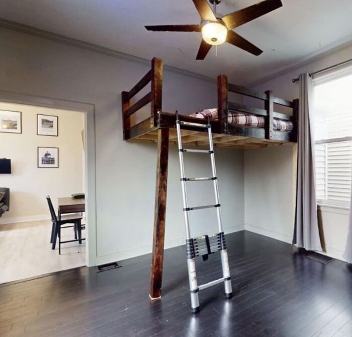 From A Local Listing (Technically Ladder And Not Stairs). Pitched As An Extra Bedroom…the Dining Room Is On One Side (With No Door), And The Only Entrance To The Actual Bedroom Is On The Opposite Wall. Yes The Brace Pole Is That Slanted, And Yes The Fan Is Directly Above The Ladder.
