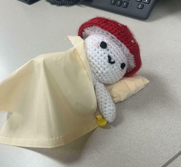 My Coworker Made A Crochet Mushroom Guy, And Someone Tucked Him In