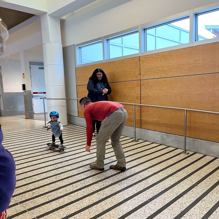 Baby Skateboarding At An Airport