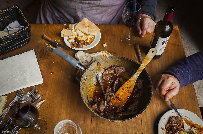 1st Place, Food At The Table: Pork, Laughter, And Red Wine By Virginia Morán