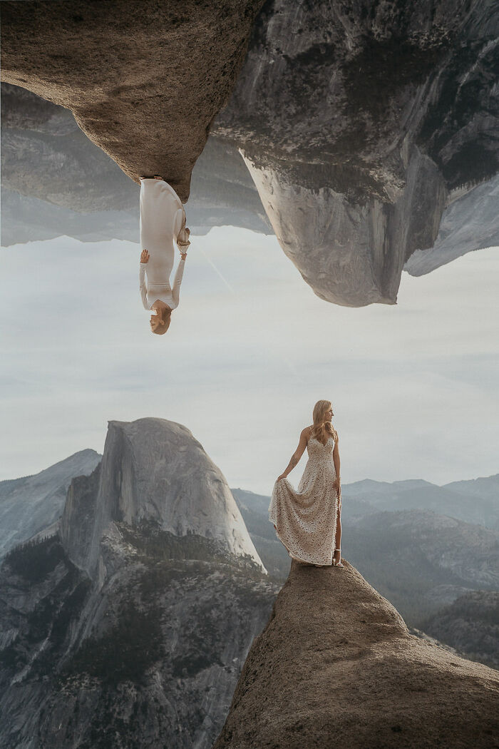 Bride in lace dress on a mountain cliff, showcasing top destination wedding photography of 2024.