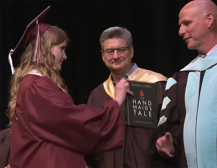 High School Graduate Refuses To Shake Superintendent’s Hand And Offers Him Banned Book On Stage