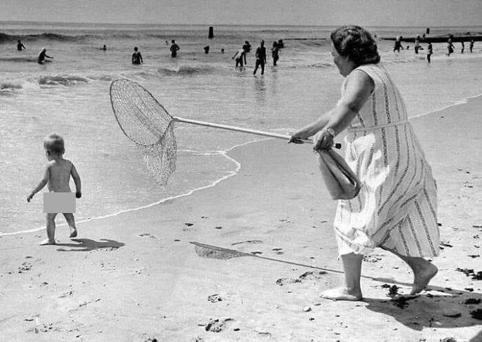 Ed Clarity's Photo Of A Woman About To Snatch A Kid From Water With A Net At Rockaway Beach ,ny,1958
