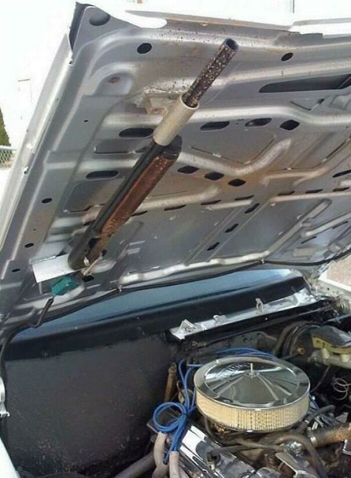 A Shotgun Concealed In The Hood Of A Car Rigged To Fire From A Switch Located In The Passenger Area