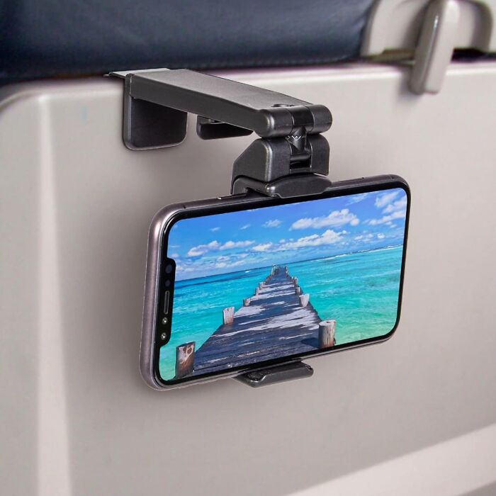 This Phone Holder Mount Lets You Catch Up On All Your Favorite Shows During Those Long-Haul Flights