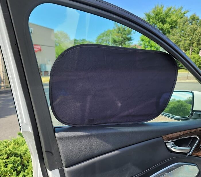 This Fluff Car Window Shade Is The Shady Bodyguard Your Little Ones (And Your Upholstery) Deserve