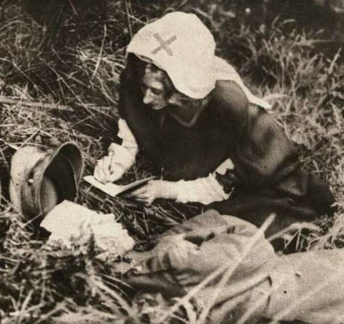 A Red Cross Nurse Writing Down Last Words Of Mortally Wounded Soldier, Taken Around 1917