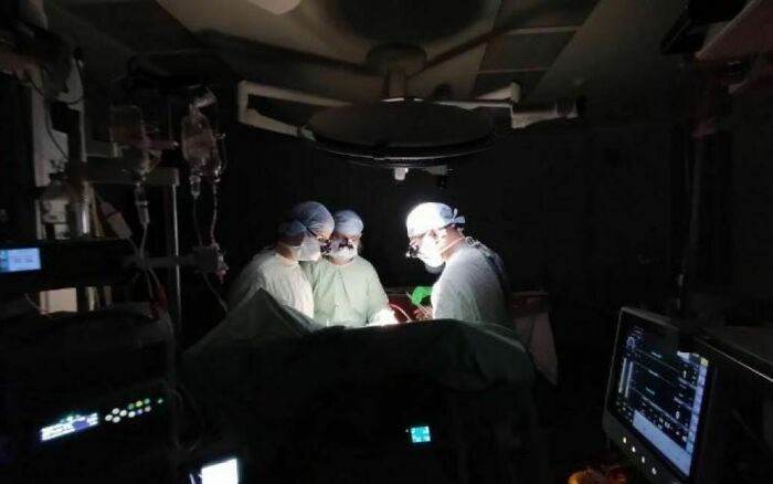 Doctors Performing A Successful Heart Surgery In The Dark In Lviv, Ukraine