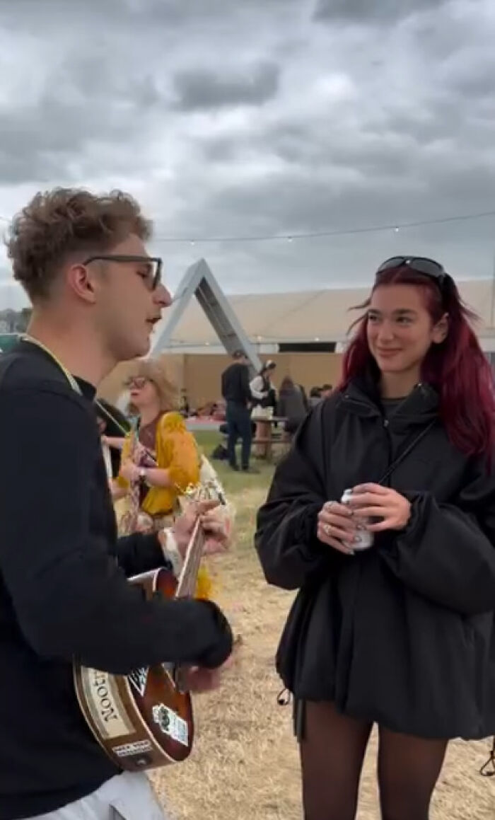 Dua Lipa "Desperate For Escape" As Fan Forces Her To Listen To His Song At Glastonbury