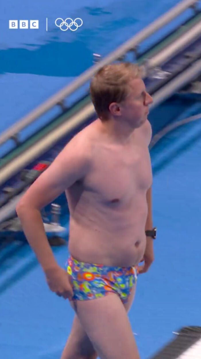 Man With “Dad Bod” And Snug Speedos Hailed A Legend For Keeping “The Olympics From Falling Apart”