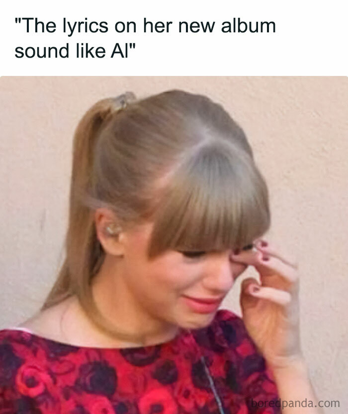 A Taylor Swift meme featuring a close-up of a woman (resembling Taylor Swift) wiping a tear from her eye, looking emotional. She is wearing a red and black floral dress and has her hair in a ponytail. The text above the image reads, "The lyrics on her new album sound like AI," humorously implying that the emotional response is due to criticism of her album's lyrics sounding artificial or computer-generated.