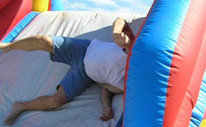 Entitled Mom Won’t Move Her Kid Out Of The Way Of An Inflatable Slide, Ends Up Regretting It