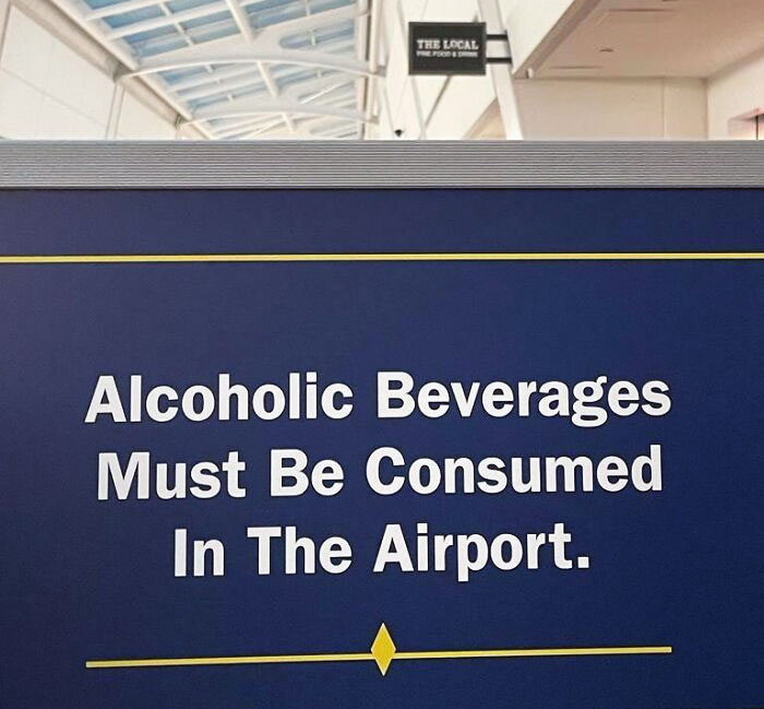 We All Know You Have To Have An Alcoholic Drink At The Airport, But It's Nice They Now Got Signs Up, Making It Mandatory