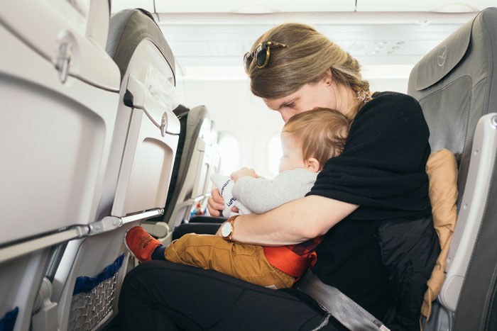 “Not A Care In The World”: Dad Shamed For Not Helping Mom Struggling On Flight With 3 Kids