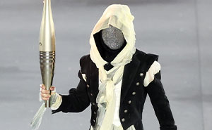 Masked Torch Bearer At The 2024 Olympics Finally Revealed—Mystery Surrounds 11 Other Athletes