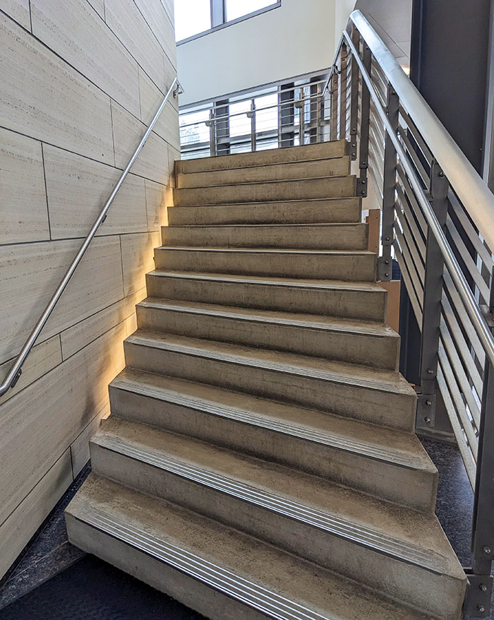 These Stairs Are At 45° Angle, So You're Guaranteed To Trip On Them. The Handrail Also Has Razor-Sharp Plates Attached To The Wall