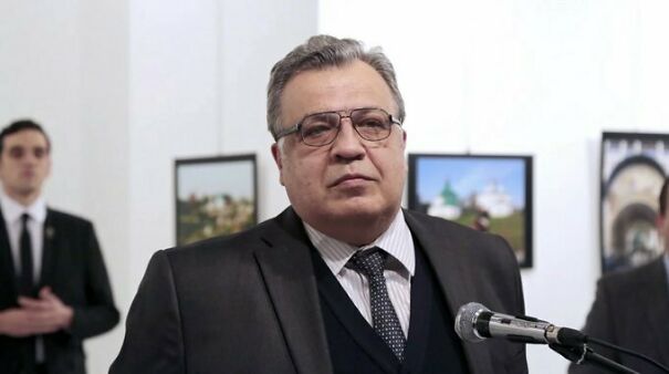 A Photo Of Andrei Karlov, The Russian Ambassador To Turkey, Captured On December 19th, 2016, Moments Before He Was Tragically Assassinated By An Off-Duty Turkish Police Officer, Who Can Be Seen In The Background