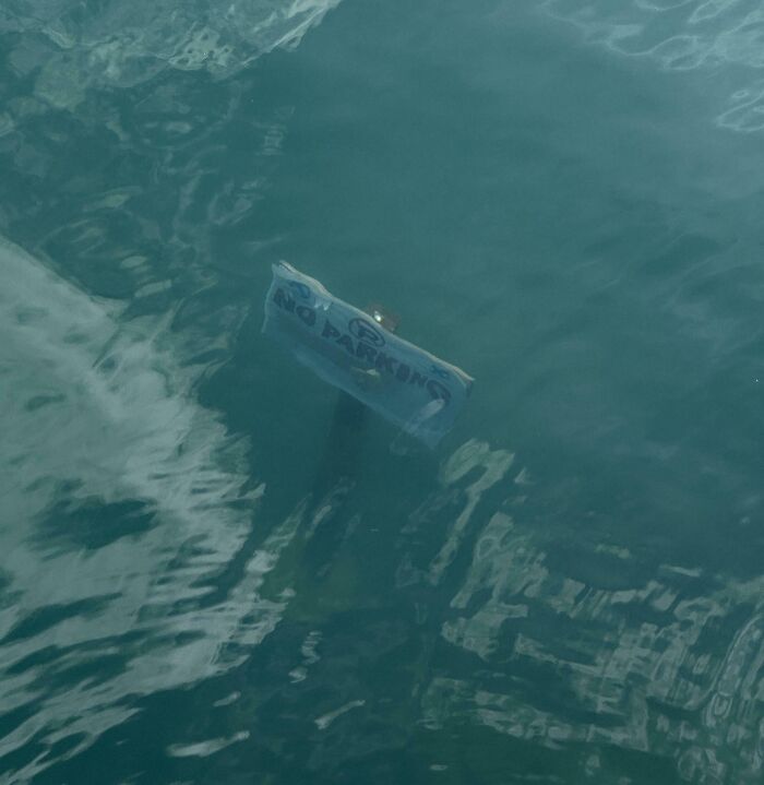 "No Parking" Sign Under The Water At A Harbor In Malta