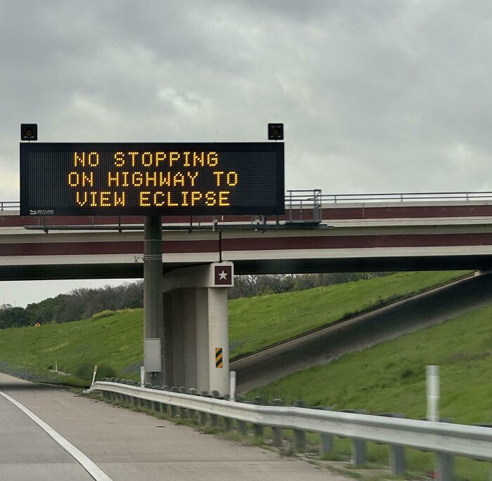 The Signs On The Side Of The Highway In Texas Warn Against Stopping On The Road For The Solar Eclipse