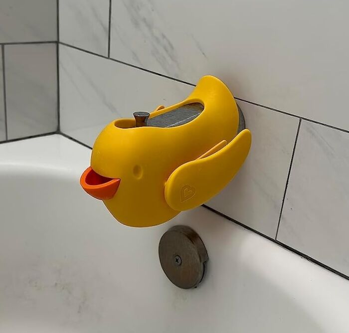 The Munchkin Beak Bath Spout Cover Is A Quack-Tastic Way To Turn Bath Time Into A Bubbly Adventure For Your Little One, Protecting Their Noggin From Bumps And Making Every Splash A Giggle-Fest!