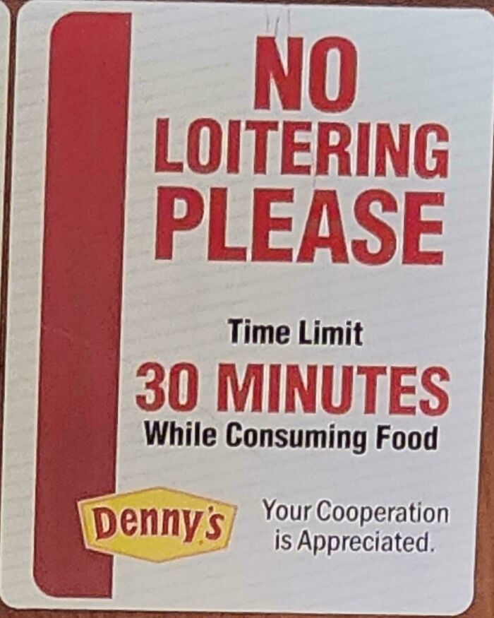 Sign at Denny's restricting dining time to 30 minutes, reflecting a boring dystopia vibe.