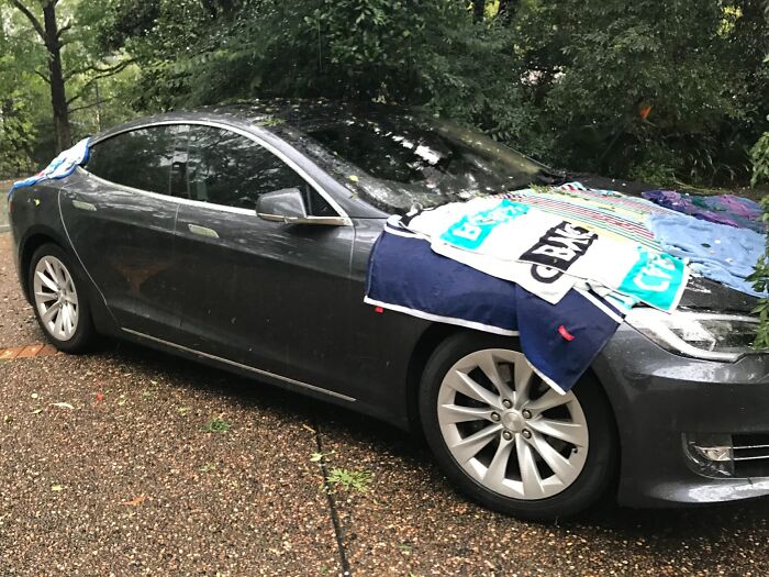 Got Caught In The Sydney Hailstorm Yesterday. Towels Didn't Save The Tesla From A Beating. Golf Ball-Sized Hail Has Left Golf Ball-Sized Dents