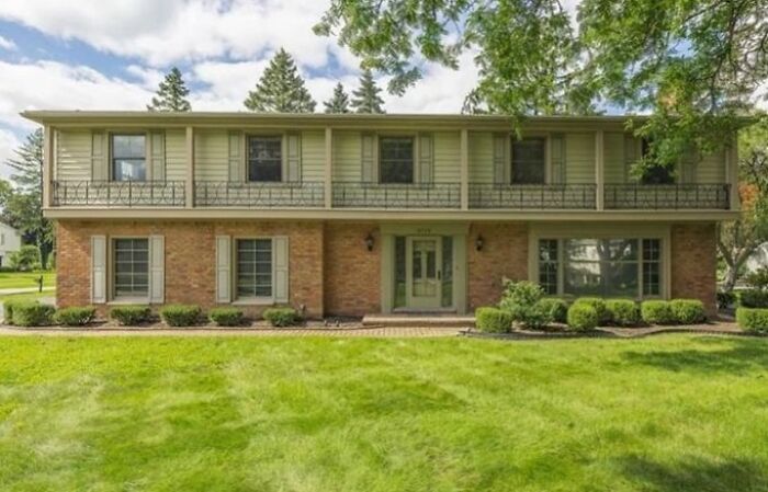 Too-Narrow Shutters? Useless Decorative “Porch”? Totally Asymmetrical Front Door? There Is No Lesser Of Any Evil Here, It’s All Pretty Sinister