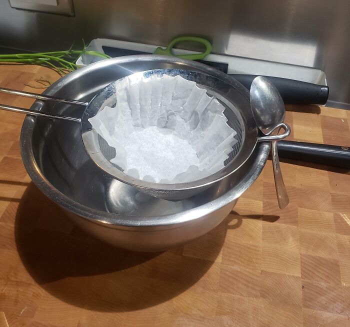 Use A Spoon To Anchor Your Strainer