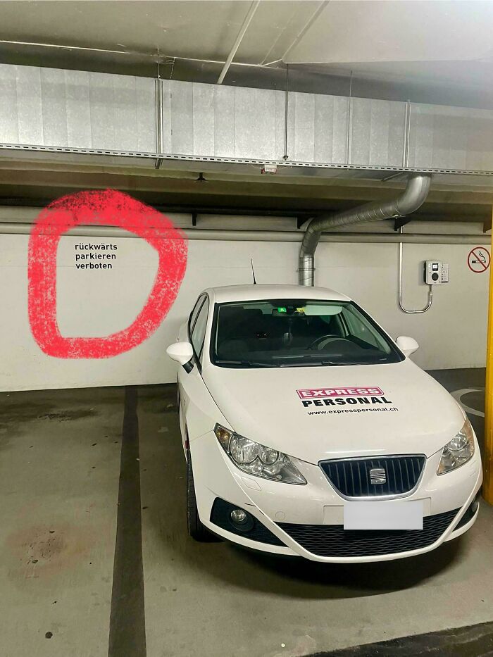 On The Wall Is Written "Do Not Park Backwards"