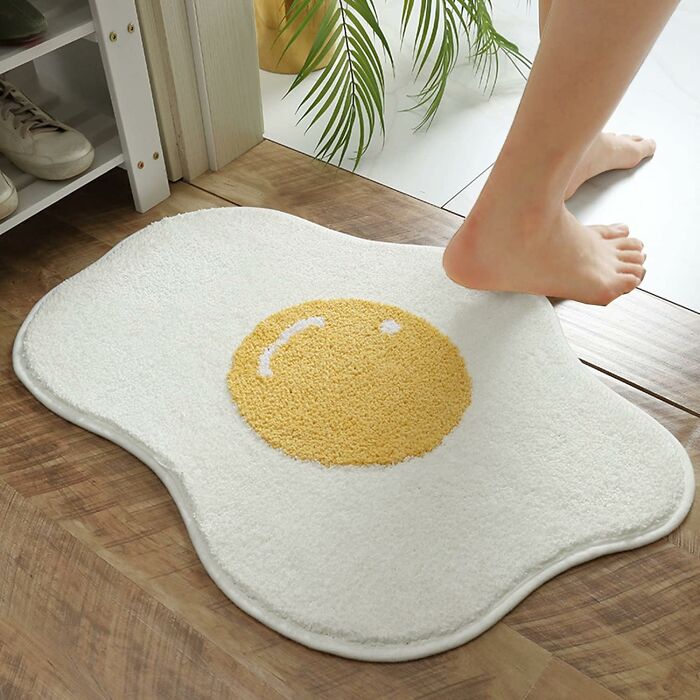 Wake Up And Smell The (Faux) Bacon! This Fried Egg Rug Is The Perfect Way To Add A Touch Of Breakfast-Themed Fun To Your Dorm Decor