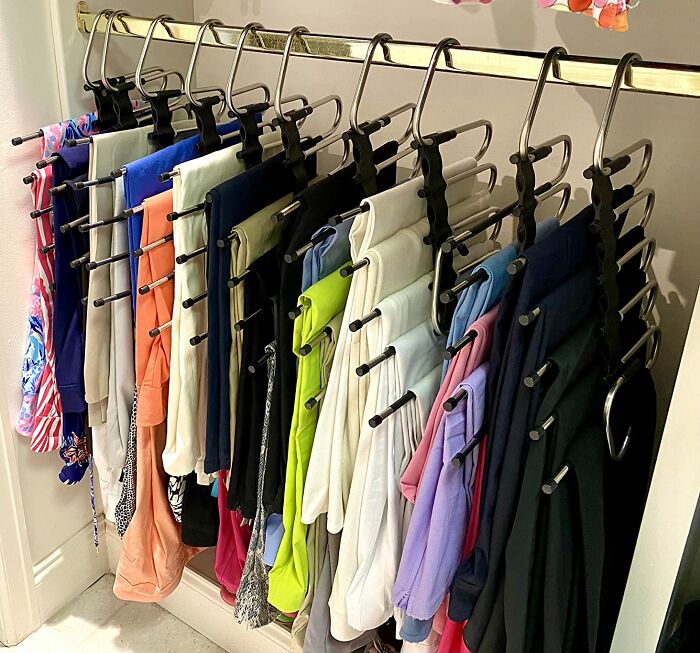 Maximize your closet space and say goodbye to cramped quarters! Instead of wasting valuable vertical space, try incorporating space-saving multi-item pants hangers. These clever hangers allow you to hang multiple pairs of trousers or blouses in a cascading fashion, instantly multiplying your hanging capacity.