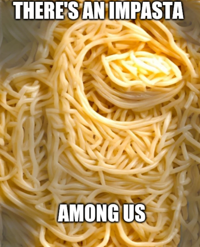 An Among Us meme featuring a pile of cooked spaghetti noodles arranged in a way that resembles the shape of an Among Us crewmate. The text at the top reads, "THERE'S AN IMPASTA," and at the bottom, "AMONG US," humorously playing on the word "impostor" by replacing it with "impasta," a pun that combines the game's terminology with a reference to pasta.