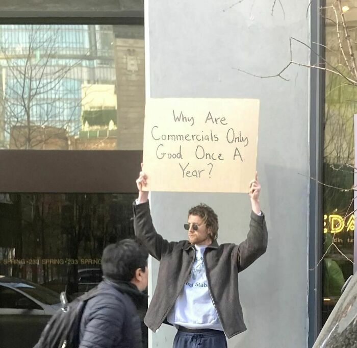 Clever-Dude-With-Sign-Annoying-Things-Protesting