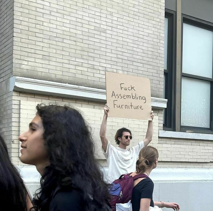 Clever-Dude-With-Sign-Annoying-Things-Protesting