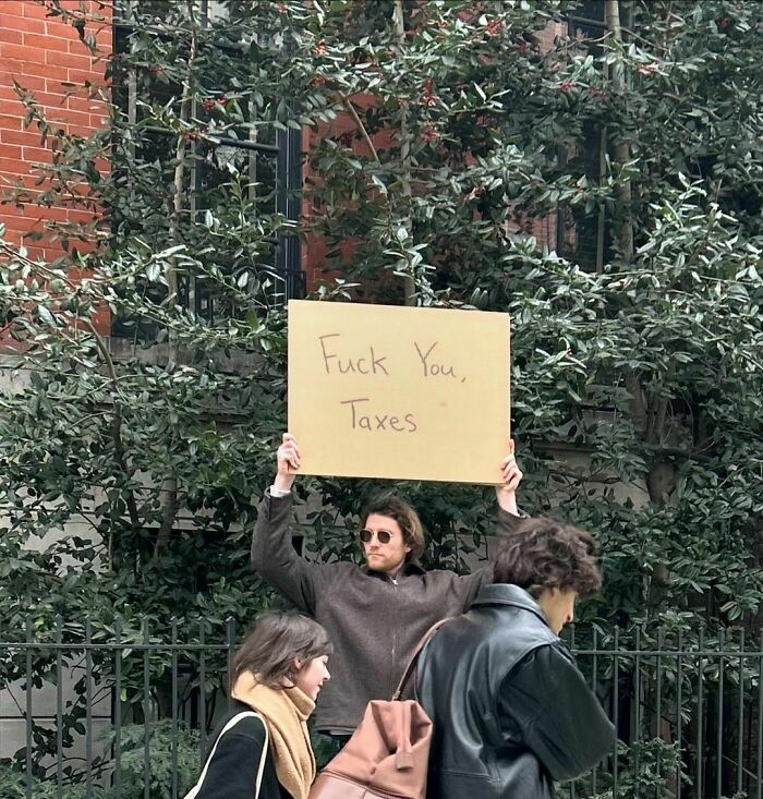 Clever-Dude-With-Sign-Annoying-Things-Protesting