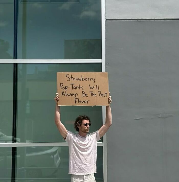 Clever-Dude-With-Sign-Annoying-Things-Protesting