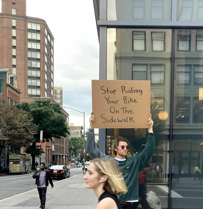 Clever-Dude-With-Sign-Annoying-Things-Protesting