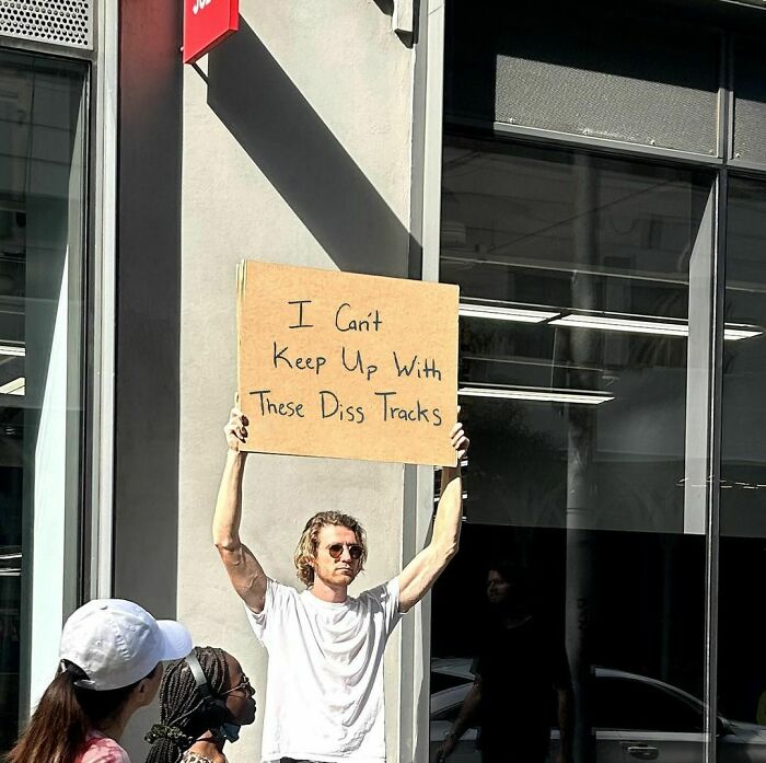 Clever-Dude-With-Sign-Annoying-Things-Protesting