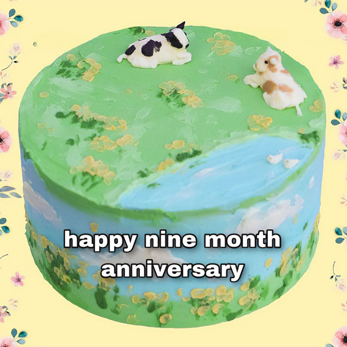 A love meme featuring a beautifully decorated cake with a green landscape design, including small flowers, a pond, and two animals lying on top. The text on the cake reads, "happy nine month anniversary." The background is adorned with delicate flower illustrations, creating a celebratory and romantic atmosphere.