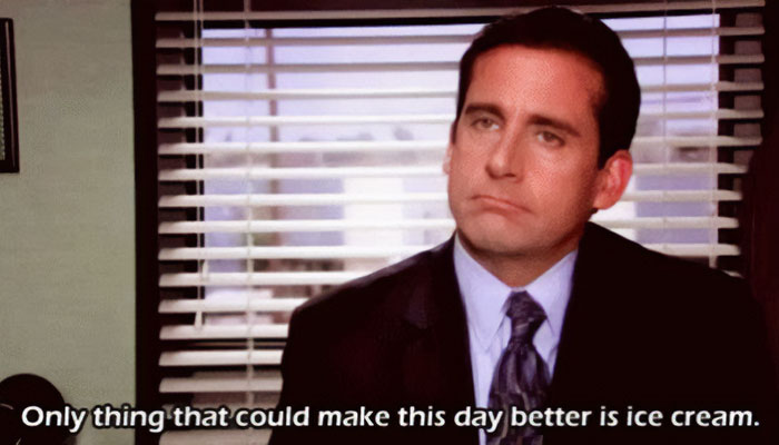 A "The Office" meme featuring Michael Scott sitting in his office with a slightly disappointed expression. The text at the bottom reads, "Only thing that could make this day better is ice cream." The meme humorously captures Michael's childlike simplicity and desire for comfort in the form of ice cream.